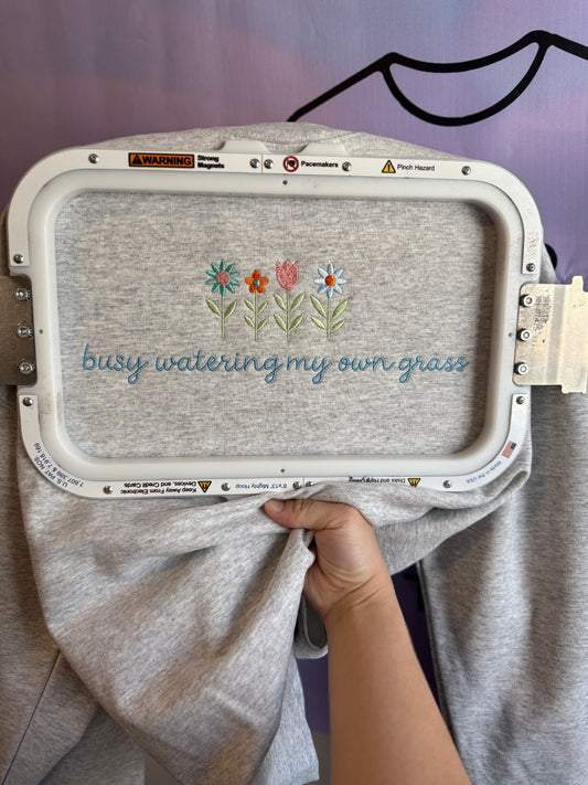 BUSY WATERING MY OWN GRASS